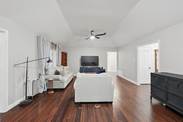 living area featuring a ceiling fan, hardwood / wood-style floors, vaulted ceiling, and baseboards