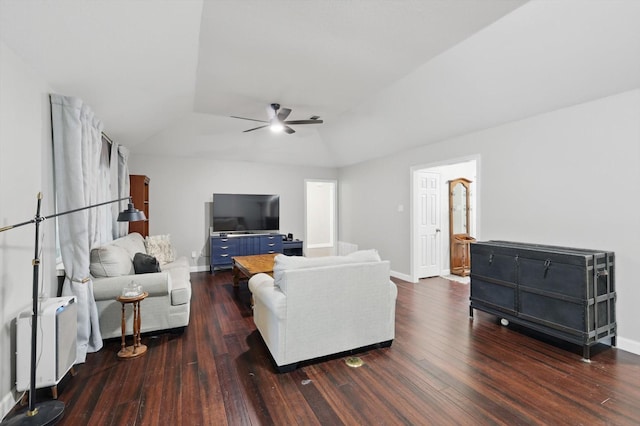 living room with lofted ceiling, wood finished floors, a ceiling fan, and baseboards