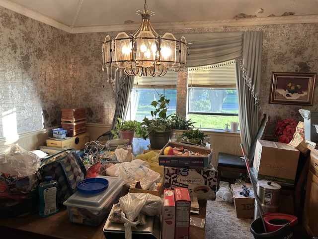 dining room with a wealth of natural light, wallpapered walls, a notable chandelier, and crown molding