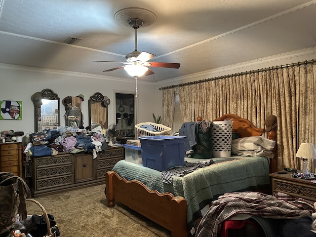 carpeted bedroom featuring visible vents, crown molding, and a ceiling fan