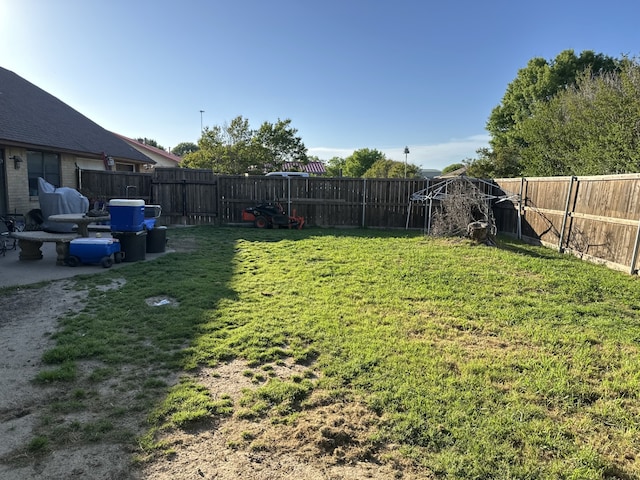 view of yard with a fenced backyard