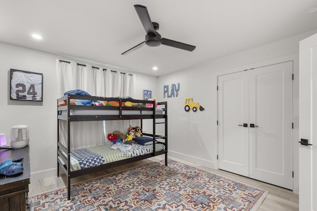 bedroom featuring recessed lighting, a ceiling fan, wood finished floors, and baseboards