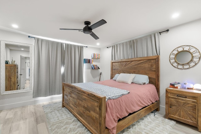 bedroom with ceiling fan, light wood-type flooring, recessed lighting, and baseboards