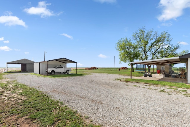 view of road with gravel driveway