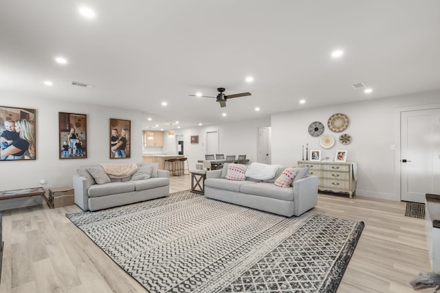 living room featuring visible vents, recessed lighting, light wood finished floors, and a ceiling fan