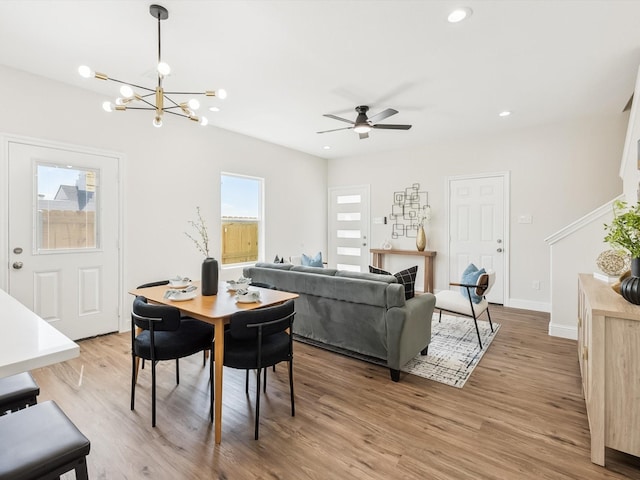 8008 W Elizabeth Ln, Fort Worth, TX 76116 - dining room featuring recessed lighting, baseboards, light wood-style flooring, and ceiling fan with notable chandelier