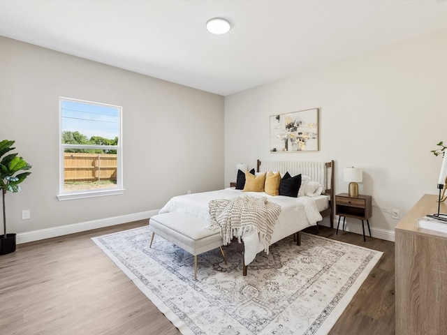 8008 W Elizabeth Ln, Fort Worth, TX 76116 - bedroom featuring baseboards and wood finished floors