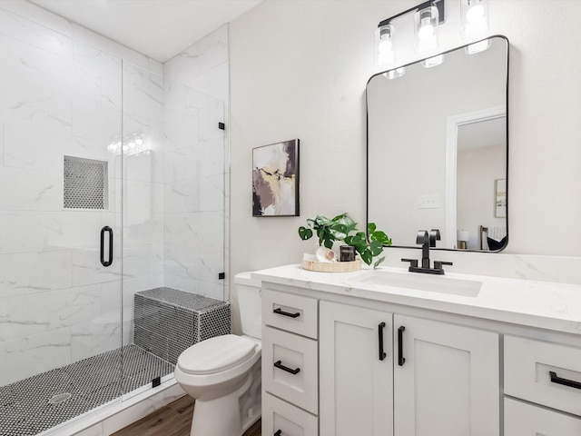 8008 W Elizabeth Ln, Fort Worth, TX 76116 - full bathroom with wood finished floors, vanity, toilet, and a marble finish shower