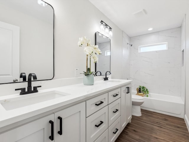 8008 W Elizabeth Ln, Fort Worth, TX 76116 - bathroom featuring double vanity, wood finished floors, toilet, and a sink