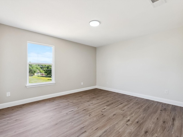 8008 W Elizabeth Ln, Fort Worth, TX 76116 - unfurnished room featuring visible vents, wood finished floors, and baseboards