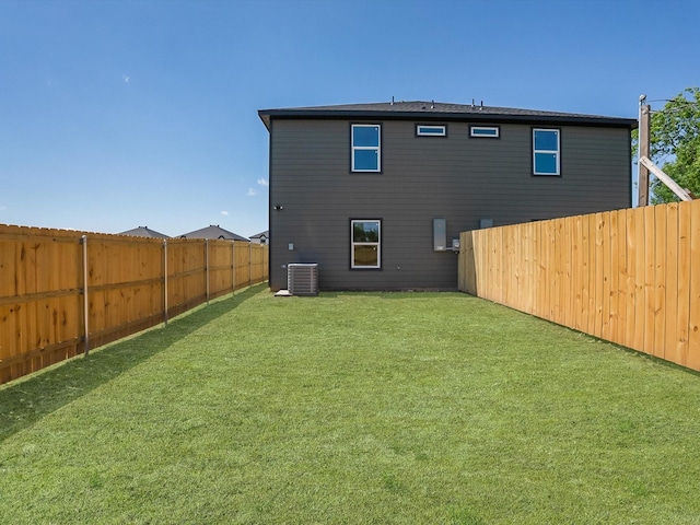 8008 W Elizabeth Ln, Fort Worth, TX 76116 - rear view of property featuring a fenced backyard, cooling unit, and a lawn