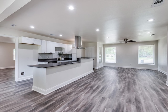 3415 Ashcroft Ct, Irving, TX 75062 - kitchen featuring visible vents, dark countertops, white cabinetry, island exhaust hood, and dark wood finished floors