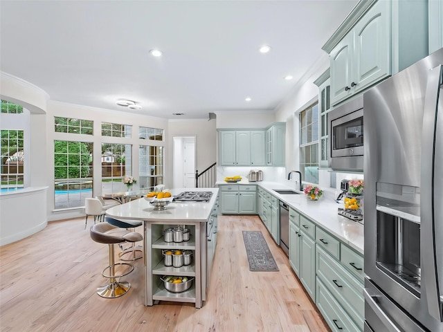 kitchen featuring ornamental molding, open shelves, appliances with stainless steel finishes, and light countertops