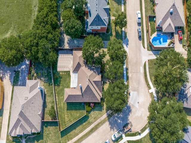 birds eye view of property with a residential view