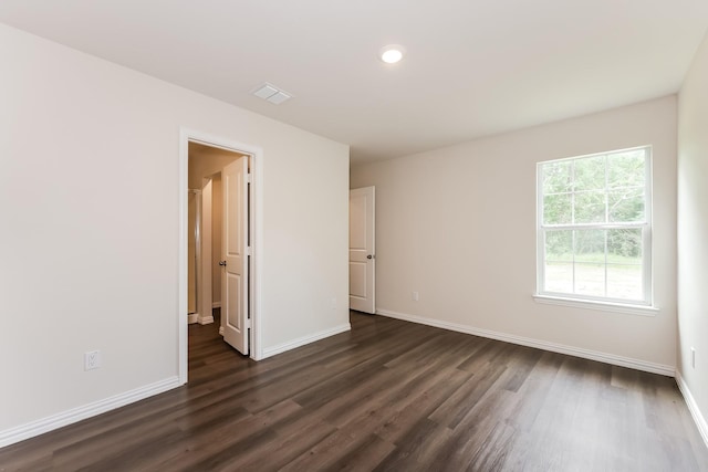 932 Dawson St, Waco, TX 76704 - empty room featuring dark wood-style flooring, visible vents, recessed lighting, and baseboards
