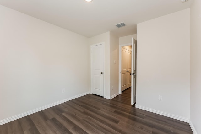 932 Dawson St, Waco, TX 76704 - spare room featuring baseboards, visible vents, and dark wood-type flooring