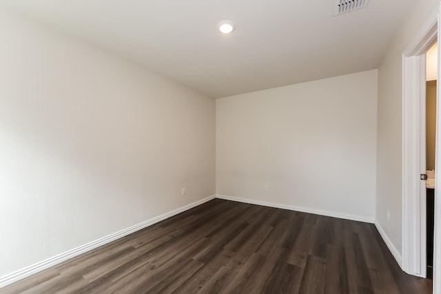 932 Dawson St, Waco, TX 76704 - spare room with dark wood-style flooring, visible vents, recessed lighting, and baseboards
