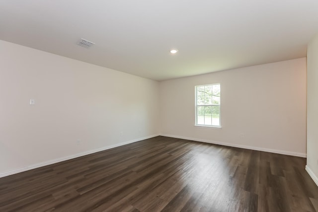 932 Dawson St, Waco, TX 76704 - empty room with baseboards, visible vents, dark wood-style flooring, and recessed lighting