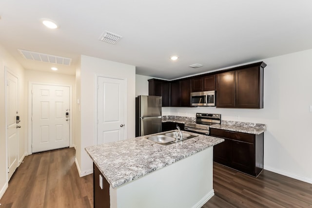 932 Dawson St, Waco, TX 76704 - kitchen featuring dark wood finished floors, visible vents, stainless steel appliances, and a sink