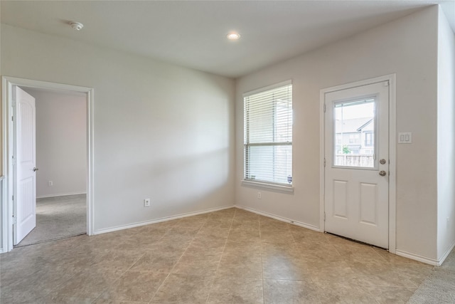 interior space featuring recessed lighting and baseboards