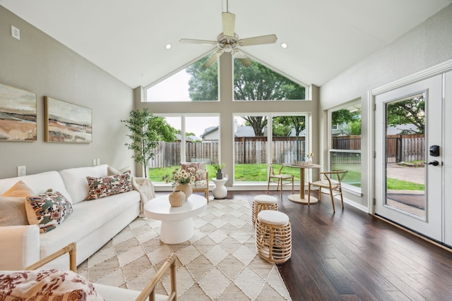 sunroom / solarium with wood finished floors and lofted ceiling