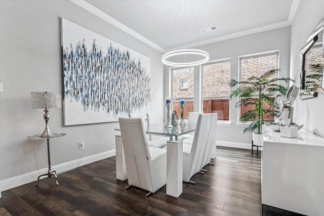 dining room featuring ornamental molding, visible vents, baseboards, and dark wood-type flooring