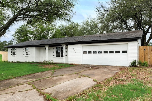 ranch-style house featuring driveway, an attached garage, fence, brick siding, and a front lawn