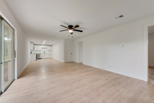 unfurnished living room featuring visible vents, a ceiling fan, light wood-style flooring, and baseboards