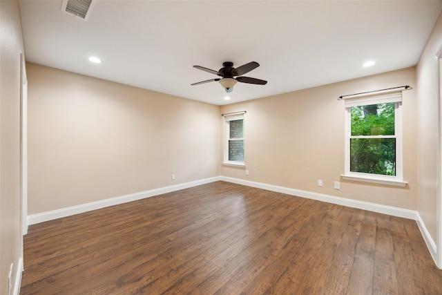 unfurnished room featuring visible vents, baseboards, ceiling fan, dark wood-type flooring, and recessed lighting