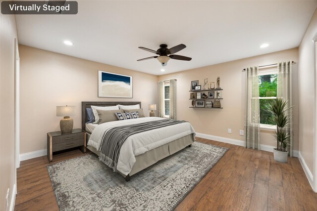 bedroom featuring baseboards, recessed lighting, and wood finished floors