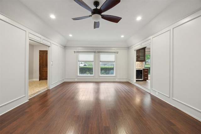 unfurnished living room with recessed lighting, dark wood-style flooring, wine cooler, and ceiling fan