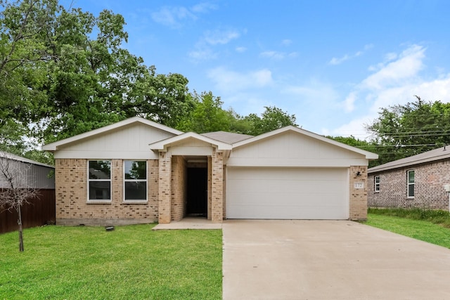 single story home with brick siding, a front lawn, driveway, and an attached garage