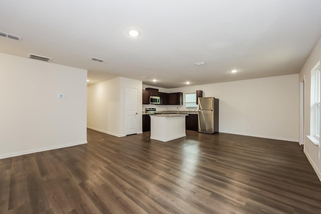 interior space featuring visible vents, open floor plan, and appliances with stainless steel finishes