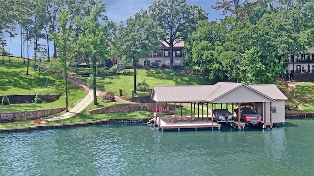 view of dock featuring a water view, a yard, and boat lift