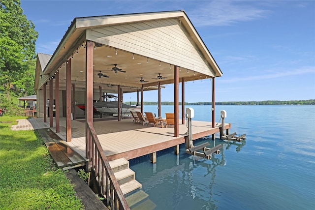 view of dock with boat lift and a water view