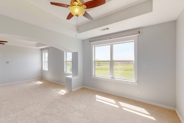 2609 Comanche Moon Dr, Fort Worth, TX 76179 - spare room with a raised ceiling, ceiling fan, visible vents, and light colored carpet
