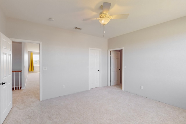 2609 Comanche Moon Dr, Fort Worth, TX 76179 - empty room with a ceiling fan, light colored carpet, and visible vents