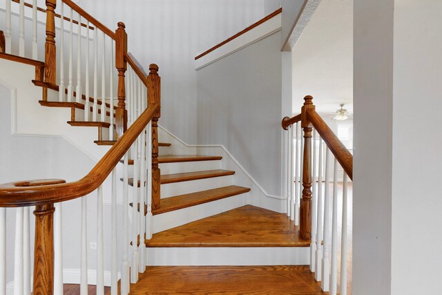 2609 Comanche Moon Dr, Fort Worth, TX 76179 - stairway featuring ceiling fan and wood finished floors