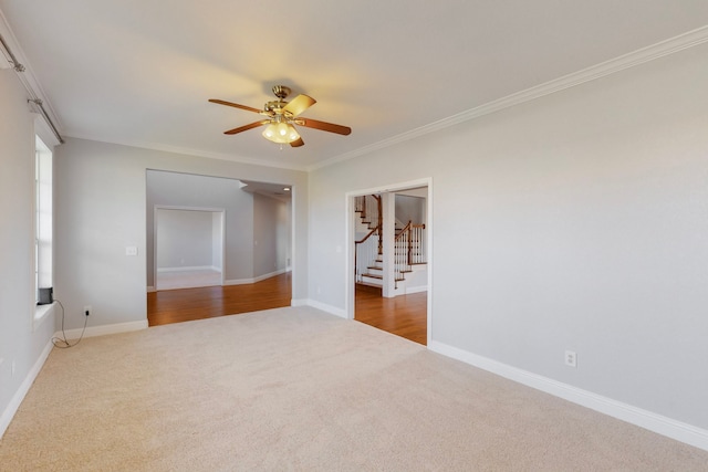 2609 Comanche Moon Dr, Fort Worth, TX 76179 - carpeted empty room featuring crown molding, a ceiling fan, baseboards, and stairway