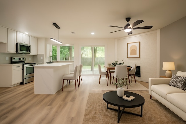 1830 Bosque Dr, Garland, TX 75040 - living area featuring recessed lighting, light wood-style floors, and a ceiling fan