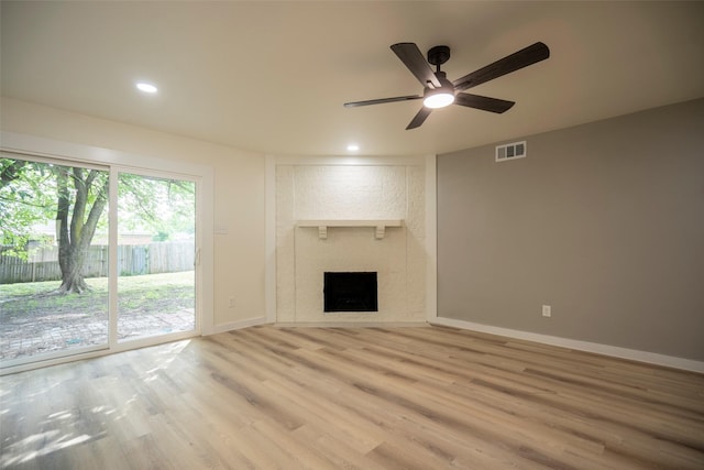 1830 Bosque Dr, Garland, TX 75040 - unfurnished living room with a ceiling fan, wood finished floors, recessed lighting, and a fireplace