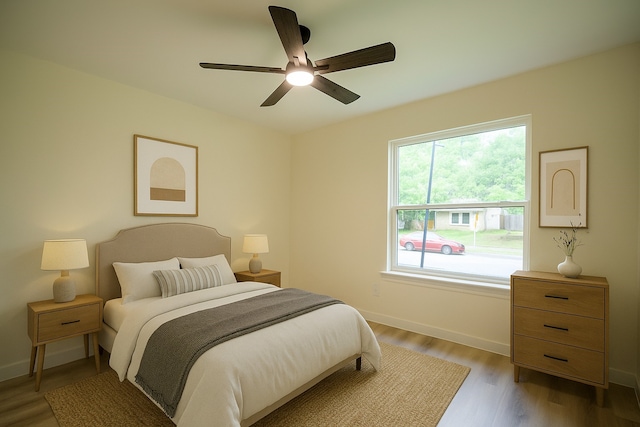 1830 Bosque Dr, Garland, TX 75040 - bedroom with light wood-type flooring and a ceiling fan