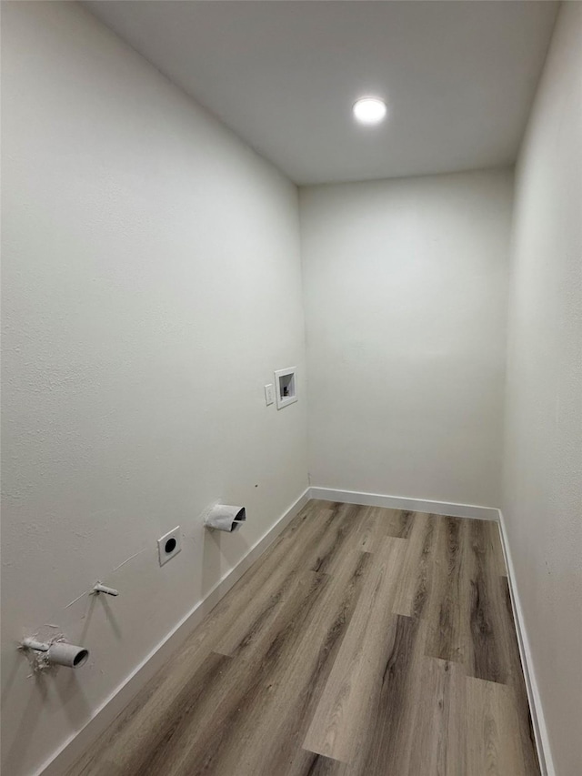 1830 Bosque Dr, Garland, TX 75040 - laundry room with hookup for an electric dryer, light wood-style flooring, and hookup for a washing machine