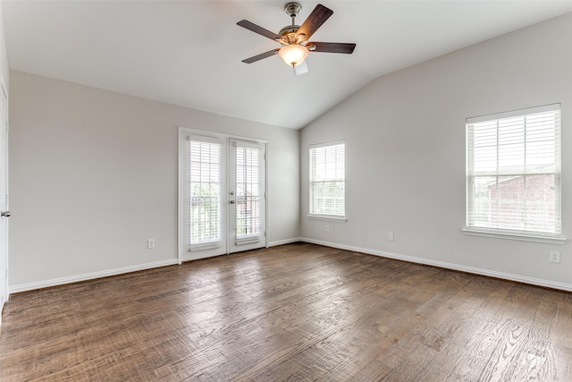 unfurnished room with dark wood-type flooring, baseboards, a ceiling fan, and lofted ceiling