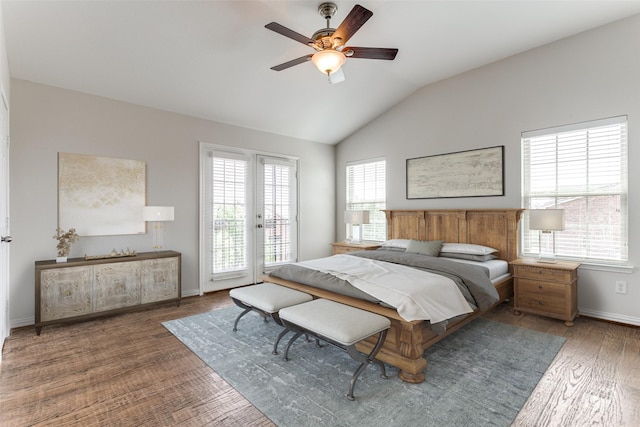 bedroom featuring ceiling fan, lofted ceiling, access to exterior, baseboards, and wood finished floors