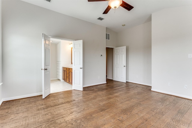 unfurnished bedroom featuring visible vents, baseboards, and light wood-style floors