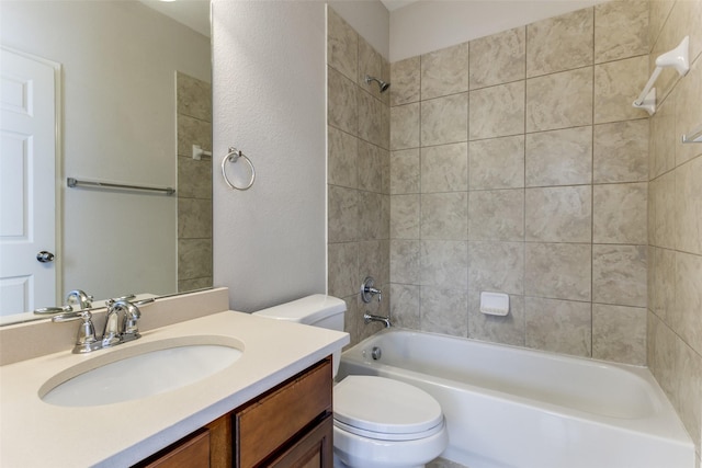 bathroom with washtub / shower combination, toilet, and vanity