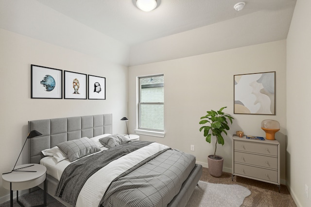 carpeted bedroom featuring baseboards