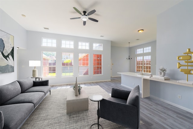 7404 Maybrook Ct, Plano, TX 75024 - living room featuring wood finished floors, a ceiling fan, and baseboards
