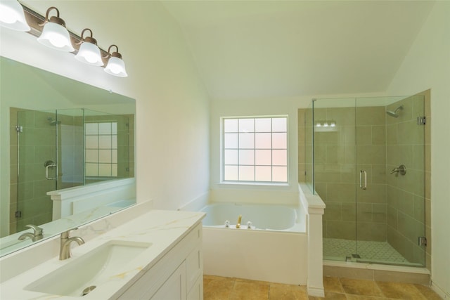 7404 Maybrook Ct, Plano, TX 75024 - full bathroom with lofted ceiling, a shower stall, a garden tub, vanity, and tile patterned floors